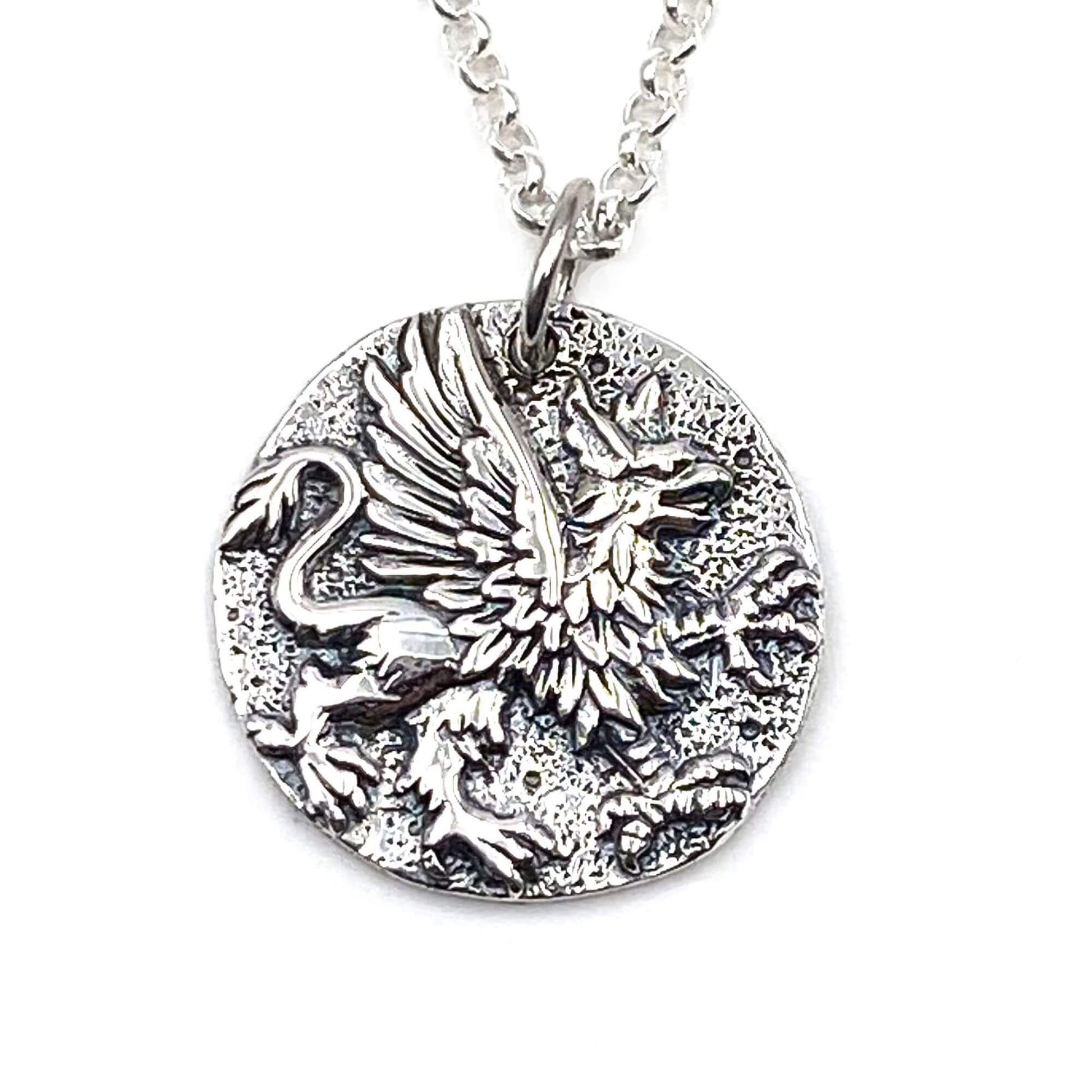 Detailed view of a Greek Mythology Griffin pendant with a eagles head, wings and a lions body.