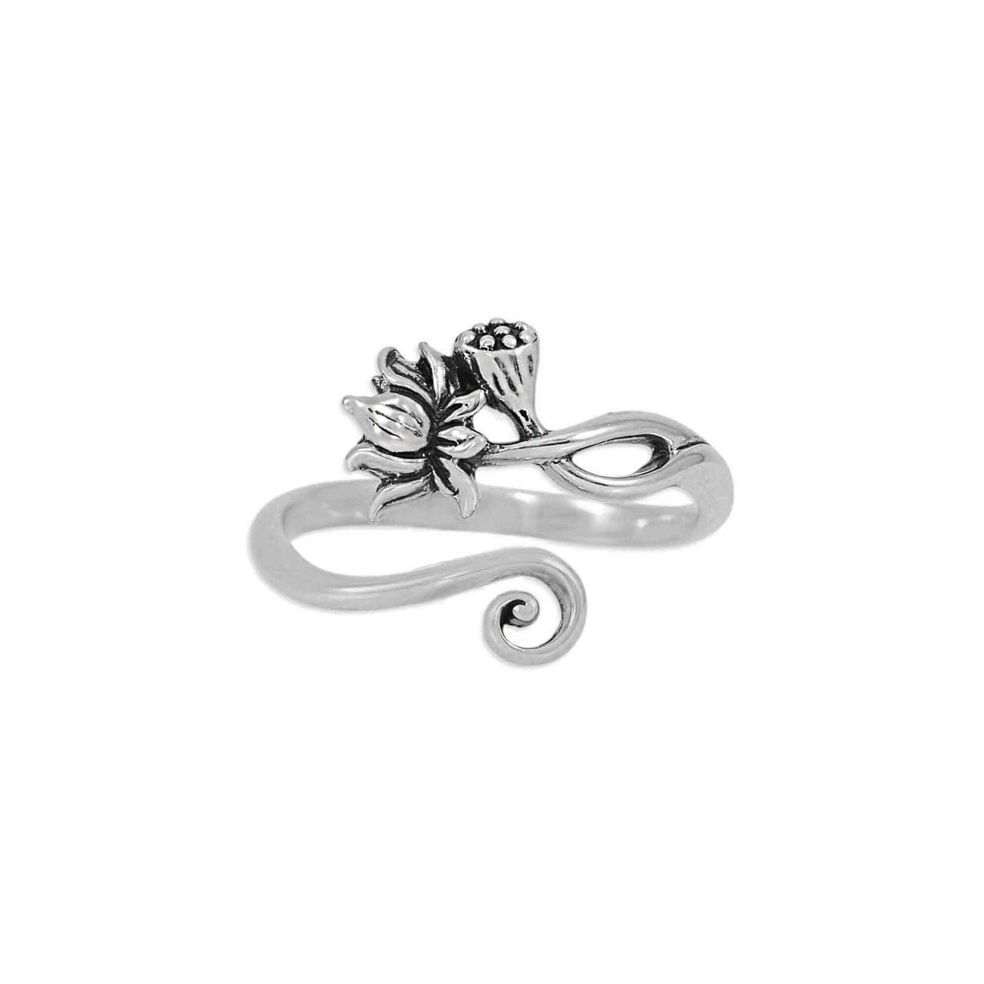 Shiny sterling silver adjustable ring for women on a white background showing the darker patina detail of the flower.