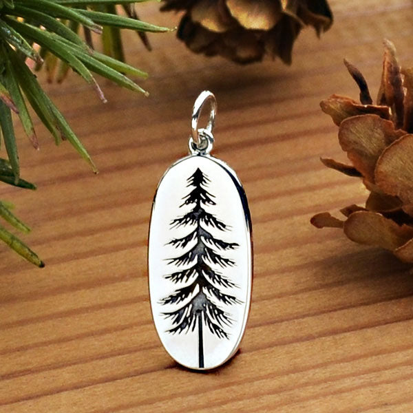 Sterling silver oval tree charm earrings.