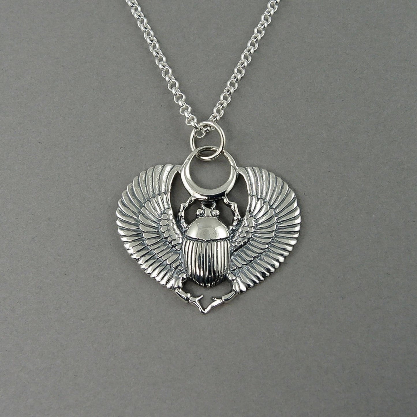 Detailed view of a Scarab Beetle pendant necklace.