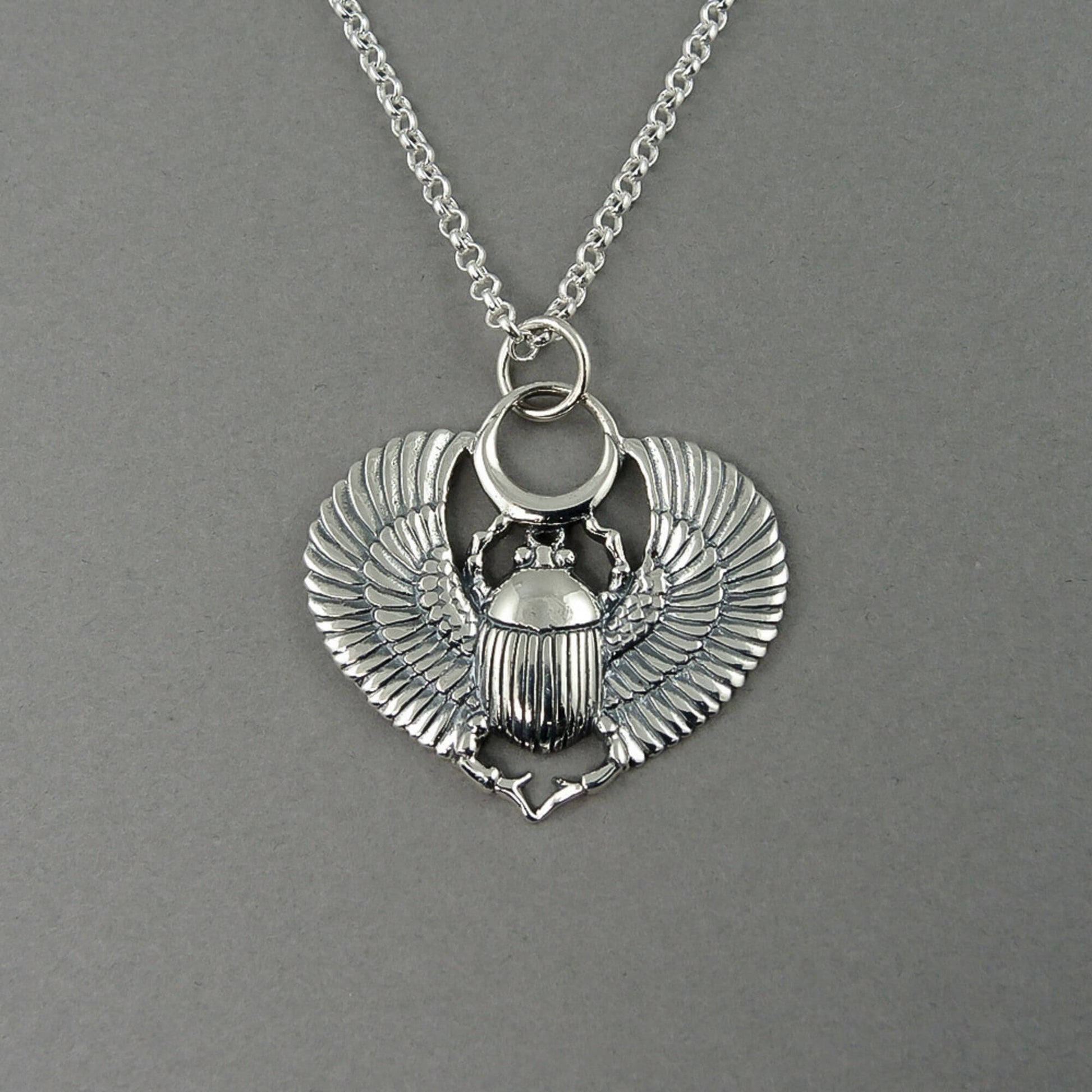Detailed view of a Scarab Beetle pendant necklace.