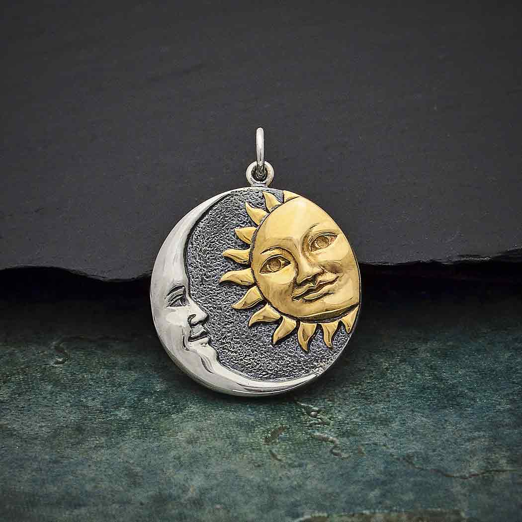 Mixed metal sun and moon silver and gold pendant charm.