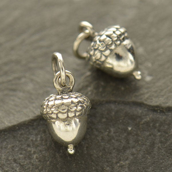 Silver tiny acorn charm. 