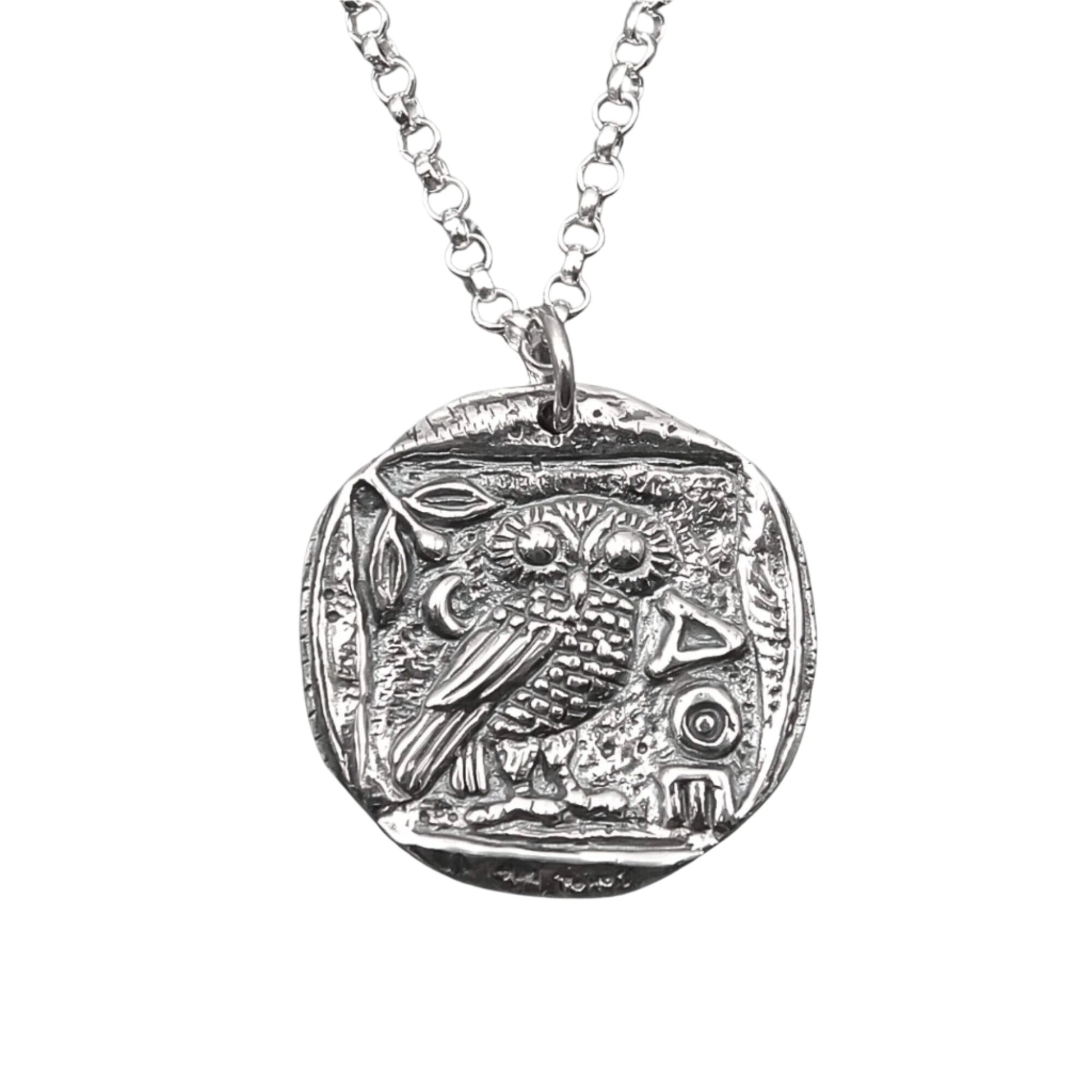 Detailed view of a handmade antiqued AOE symbol with an Owl pendant. 