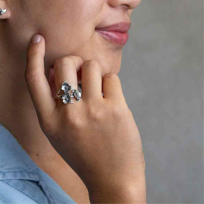 Hand model with the 925 soild sterling silver floral ring that is adjustable to size and fit. Lovely mothers day gift. 