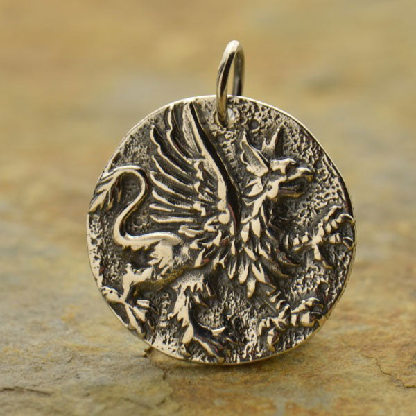 Silver griffin eagle and lion pendant. 
