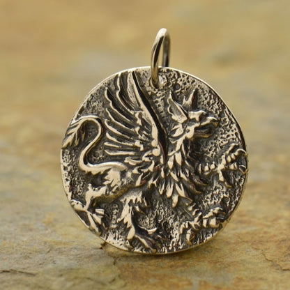 Silver griffin eagle and lion pendant. 