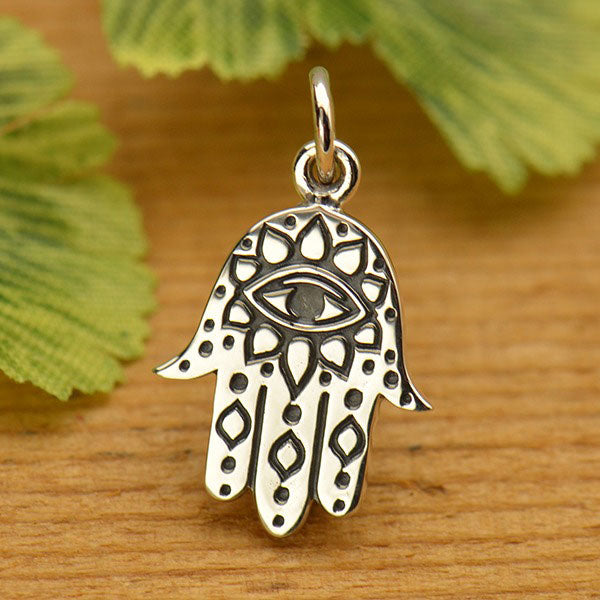 Sterling silver hamsa hand earrings.