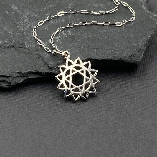 Heart Chakra geometric shaped sterling silver charm on a sterling silver chain.