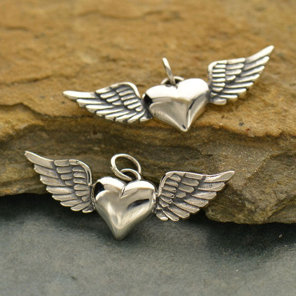 Sterling silver heart with wings pendant. 