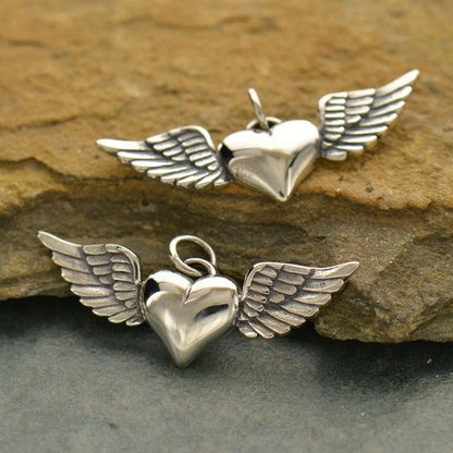 Sterling silver heart with wings pendant. 