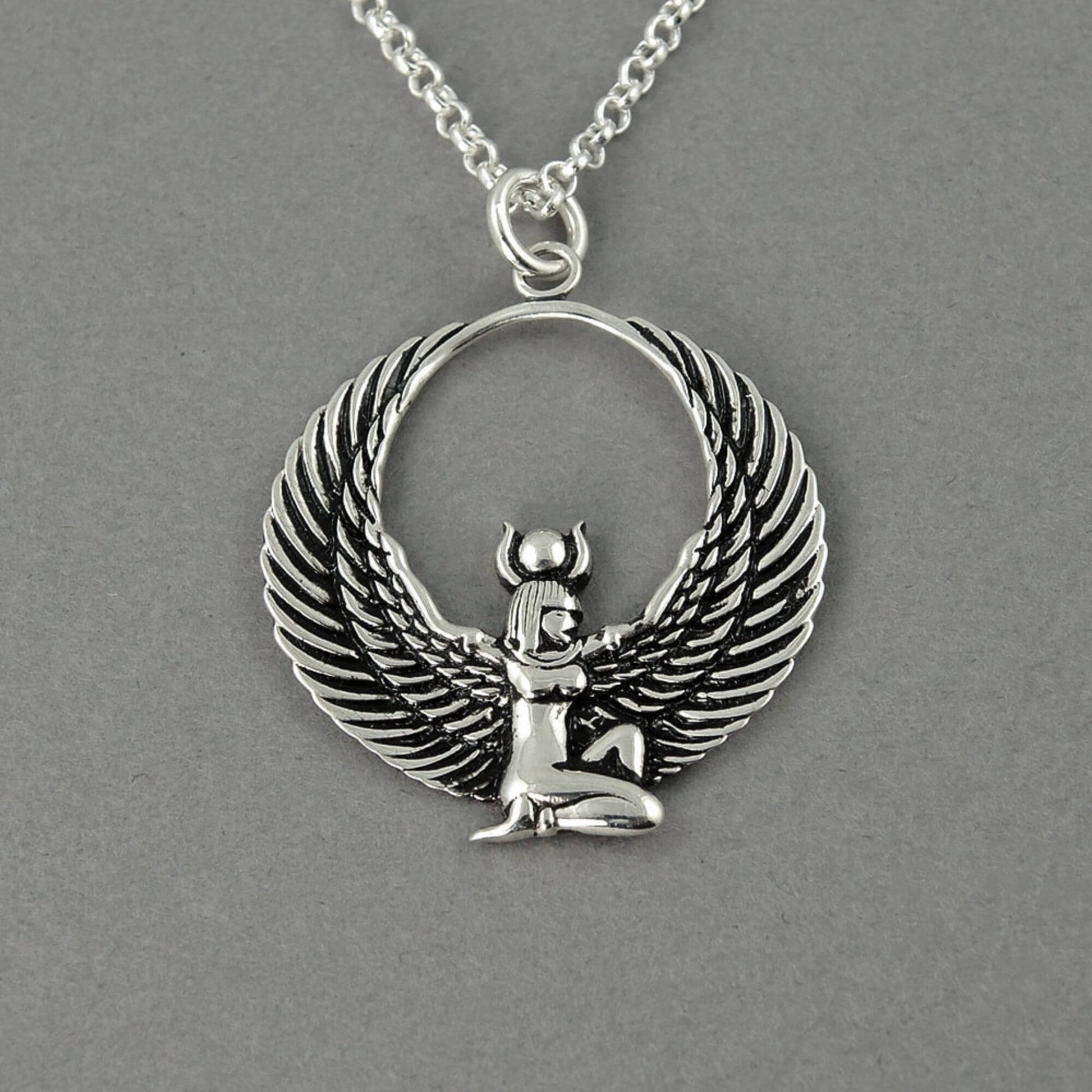 Detailed view of a Egyptian symbol of a the goddess Isis as a pendant for a chain for females.