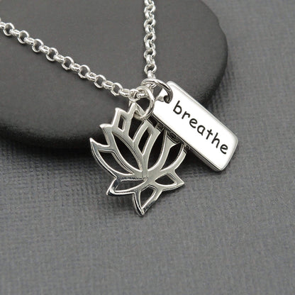 Lotus flower shaped and breathe word silver charms on a sterling silver chain jewelry gift for women. Yoga collection.