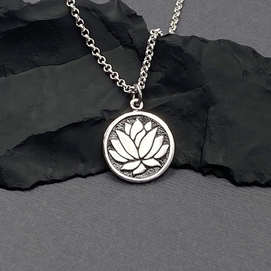 Lotus flower round shaped silver ygoa charm on a sterling silver chain. Jewelry gifts for women.