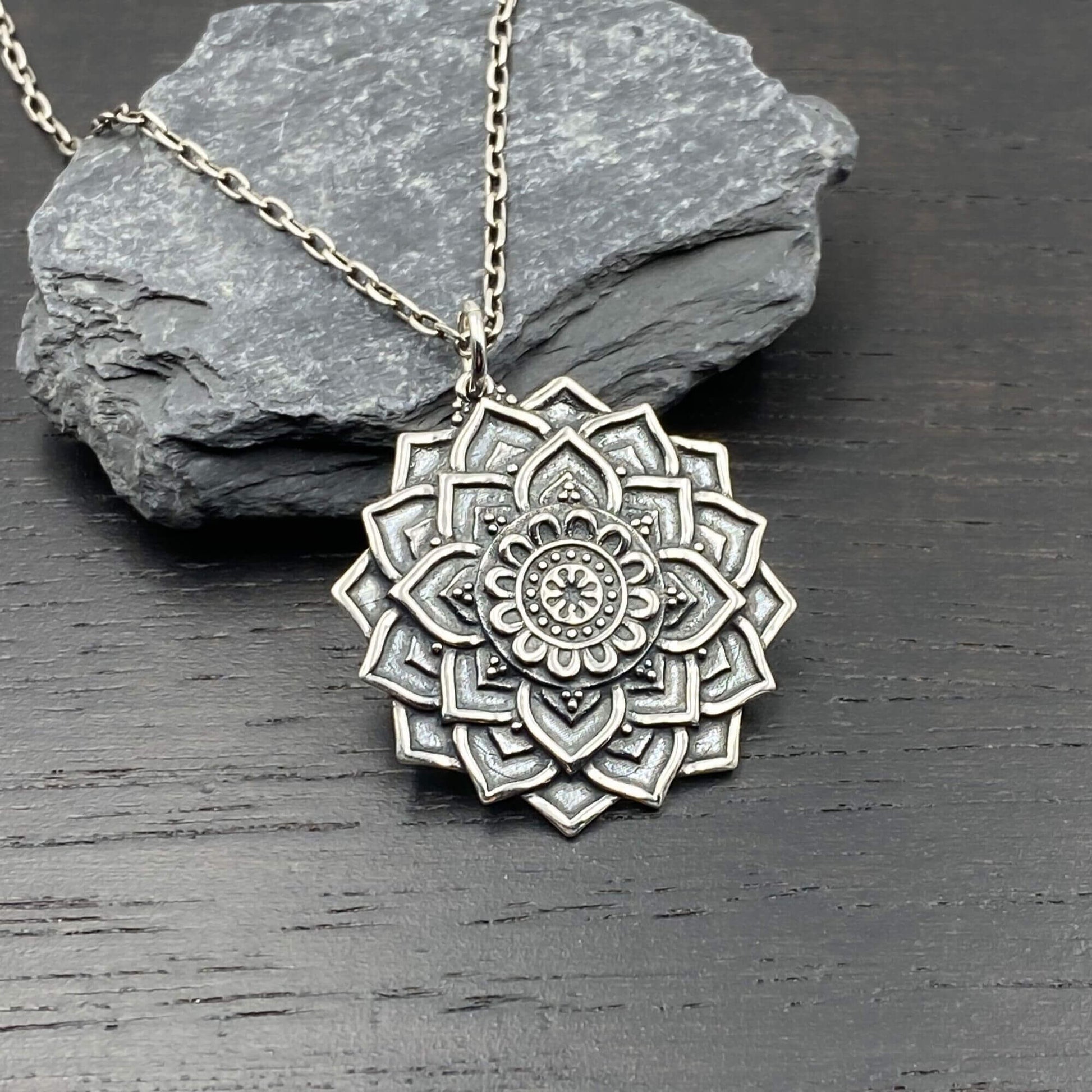 Mandala Flower shaped silver large pendant, with three dimensional and etched art detail, on a sterling silver chain.