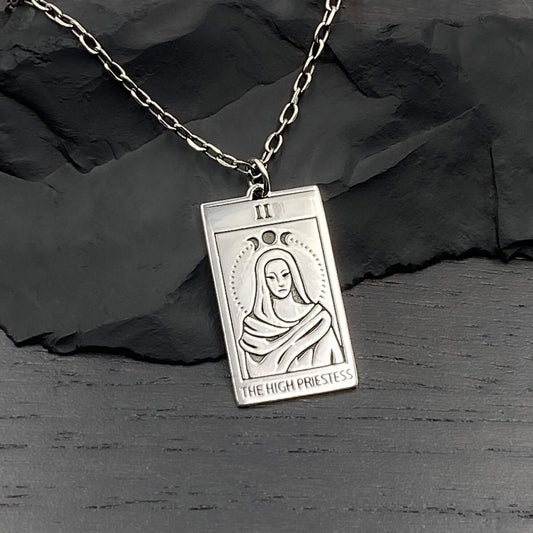 Rectangle shaped silver tarot card pendant on a sterling silver chain. The tarot symbolizes the High Priestess with a triple moon halo.