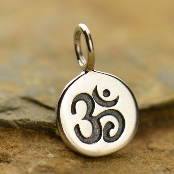 Sterling silver tiny ohm charm earrings. 