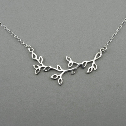 Tree branch shaped silver floating pendant on a sterling silver chain for women.