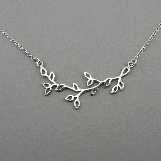 Tree branch shaped silver floating pendant on a sterling silver chain for women.