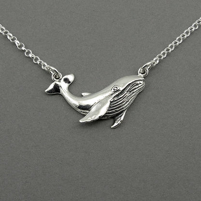 Sterling silver humpback whale pendant floating on the silver chain.  The whale is detailed.